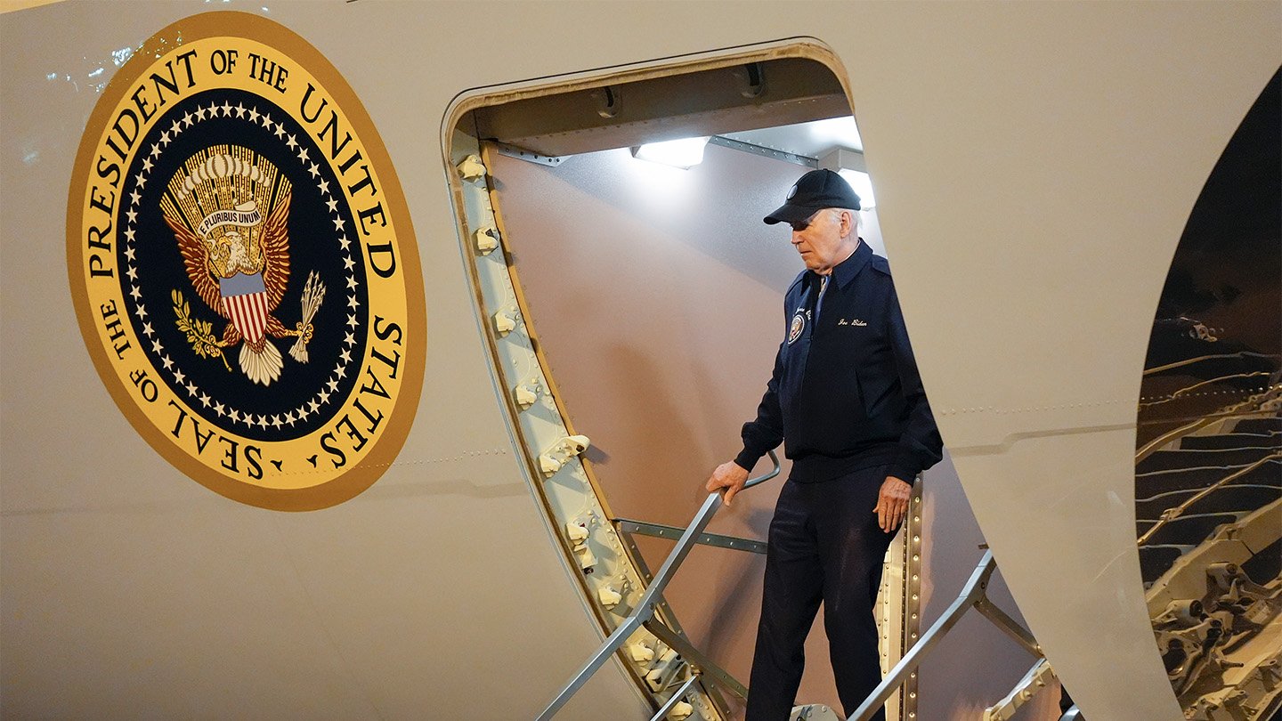 President Joe Biden exits Air Force One, the presidential plane